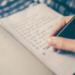 Student reviewing practice test results with notes