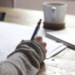 Student planning study schedule with calendar