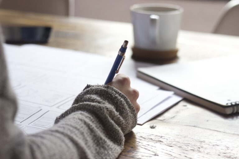 Student planning study schedule with calendar