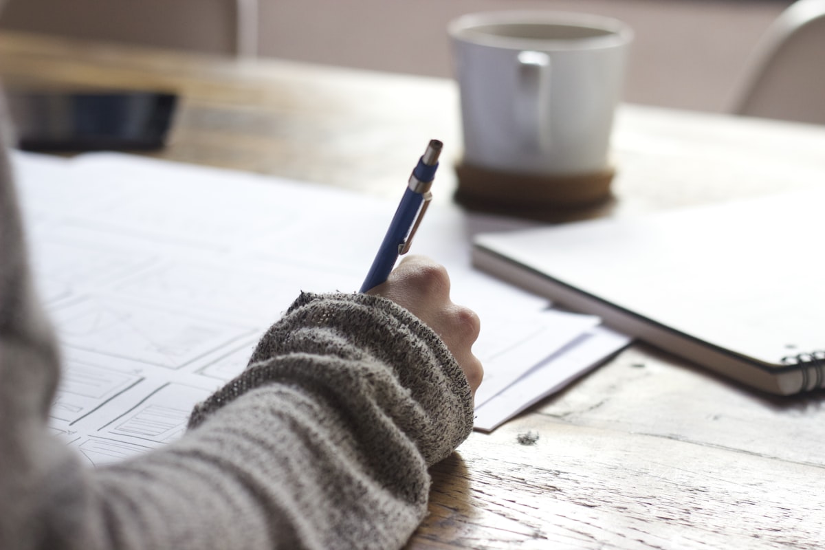 Student planning study schedule with calendar